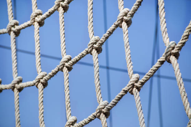 istock a net of thin ropes on the playground, close-up. 1301160940