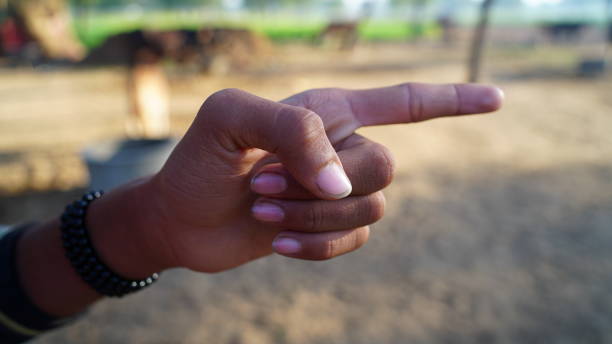 istock Annoyance and threatening expression of finger with refusal expression. Raise finger closeup. 1301162348