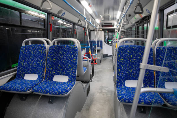 istock Empty bus interior. Blue seats without passengers. Public transport. Transportation of passengers by public transport. Ergonomic interior of the bus. Travel to other cities. 1301162830