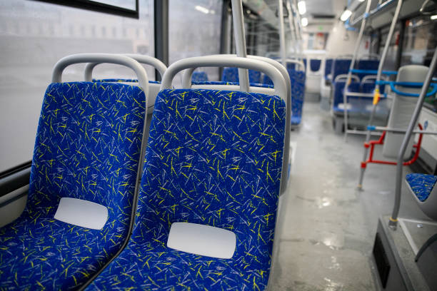 istock Empty bus interior. Blue seats without passengers. Public transport. Transportation of passengers by public transport. Ergonomic interior of the bus. Travel to other cities. 1301162880