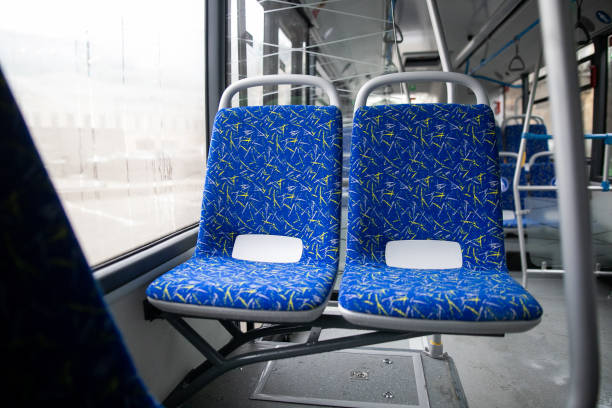istock Empty bus interior. Blue seats without passengers. Public transport. Transportation of passengers by public transport. Ergonomic interior of the bus. Travel to other cities. 1301162890