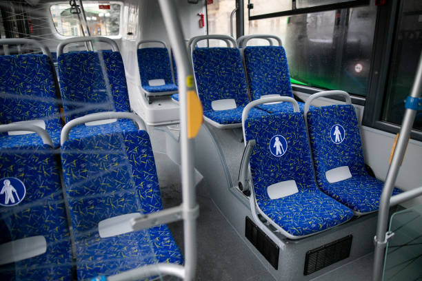 istock Empty bus interior. Blue seats without passengers. Public transport. Transportation of passengers by public transport. Ergonomic interior of the bus. Travel to other cities. 1301162914