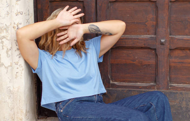 istock Young woman hide her face with hands 1301162955
