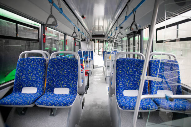 istock Empty bus interior. Blue seats without passengers. Public transport. Transportation of passengers by public transport. Ergonomic interior of the bus. Travel to other cities. 1301162956