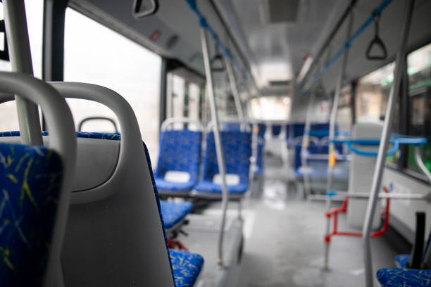 istock Empty bus interior. Blue seats without passengers. Public transport. Transportation of passengers by public transport. Ergonomic interior of the bus. Travel to other cities. 1301162966