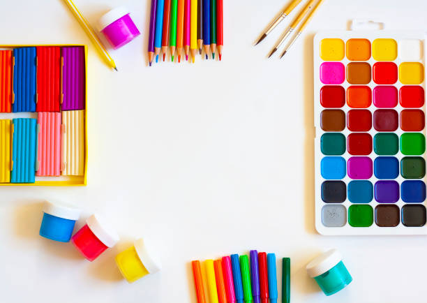 istock Stationery for school and creative work on a white background, paints, pencils, markers and plasticine, flat lay, copy space 1301164494