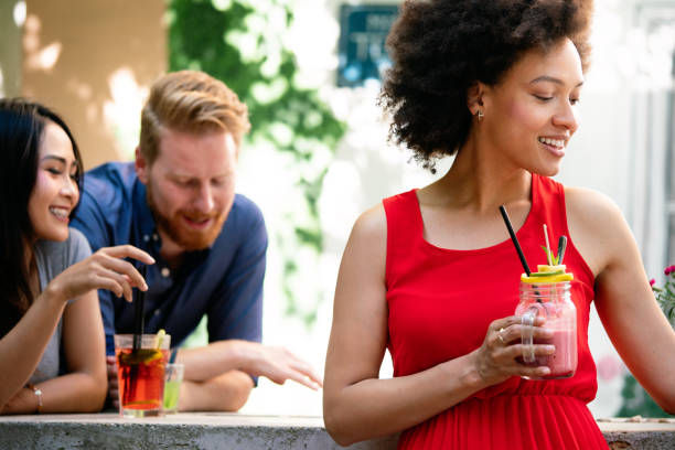istock Multiracial group of friends having fun and talking in restaurant 1301165830