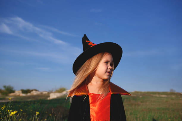 istock little girl dressed as a witch celebrates halloween 1301168211