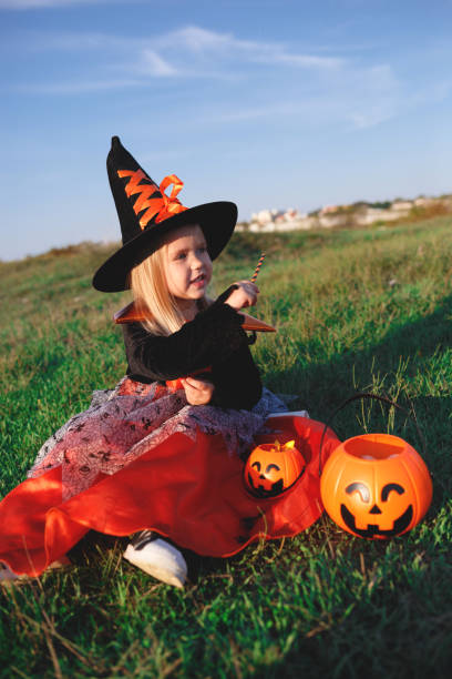 istock little girl dressed as a witch celebrates halloween 1301168229