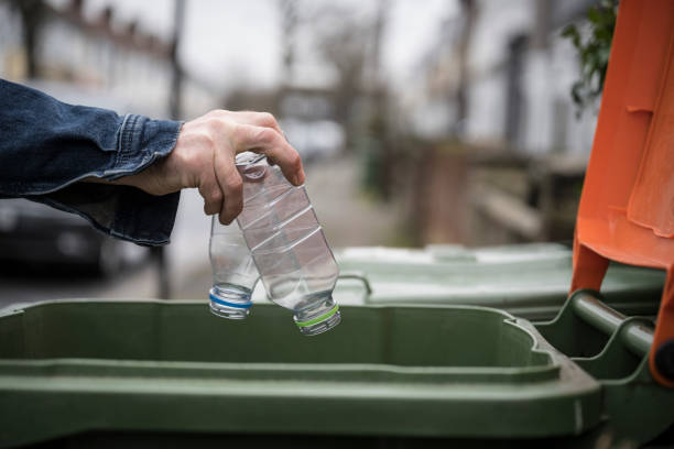 istock Socially responsible Caucasian man recycling plastic bottles 1301169574