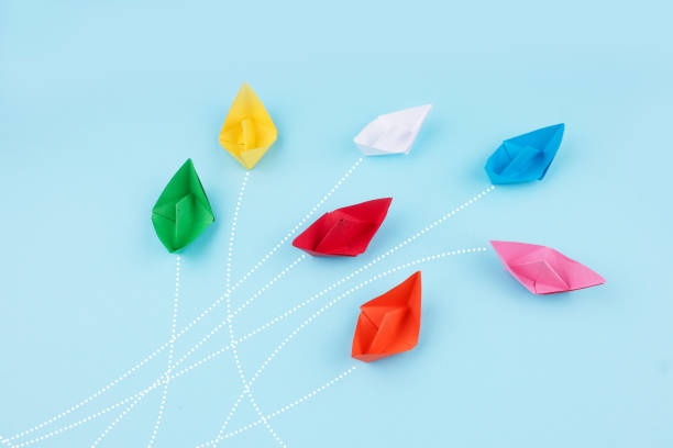 istock Paper ships on blue background. Business competition, different vision creative and Innovative solution for business concepts 1301171171