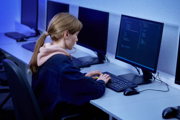 istock A beautiful woman works as an online programmer in an office. Computer room. 1301171562
