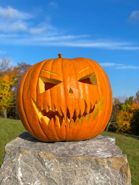 istock PORTRAIT: Big orange pumpkin decoration with a scary face on Halloween 1301175366