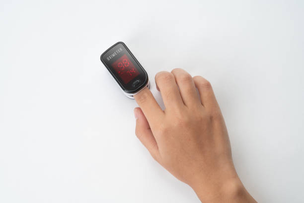 istock Hand measuring oxygen saturation with pulse oximeter 1301176371