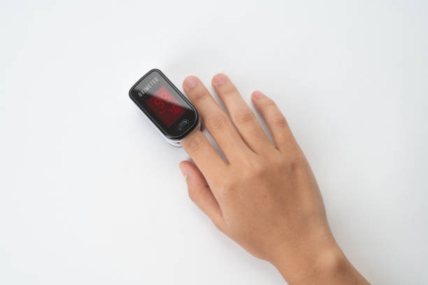 istock Hand measuring oxygen saturation with pulse oximeter 1301178095