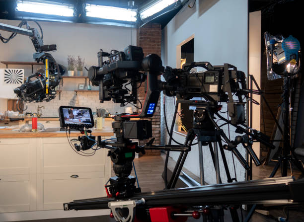 istock close up of video camera in TV studio 1301178514