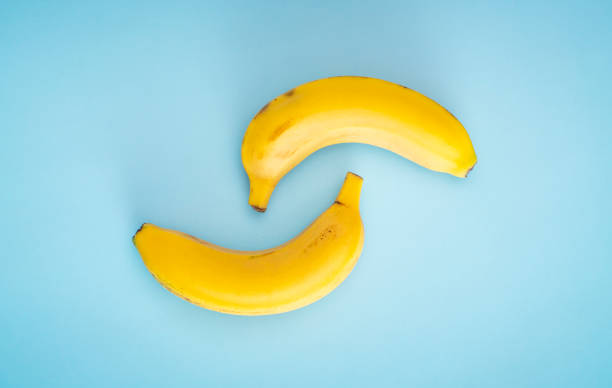 istock Yellow bananas on the blue background 1301178833