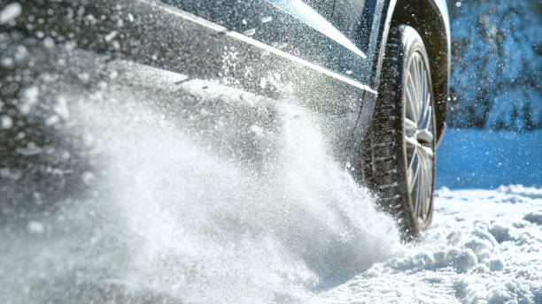 istock CLOSE UP, DOF: Fresh snow flies up from a large vehicle's spinning wheel. 1301180218