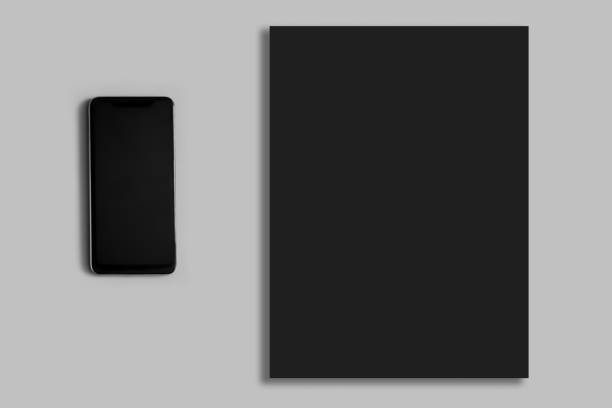 istock Black blank sheet on gray background. Telephone. 1301180933