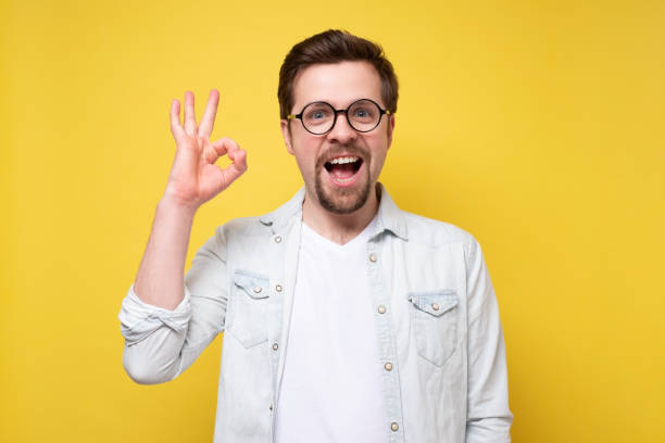 istock Handsome caucasian man with beard smiling positive doing ok 1301185187