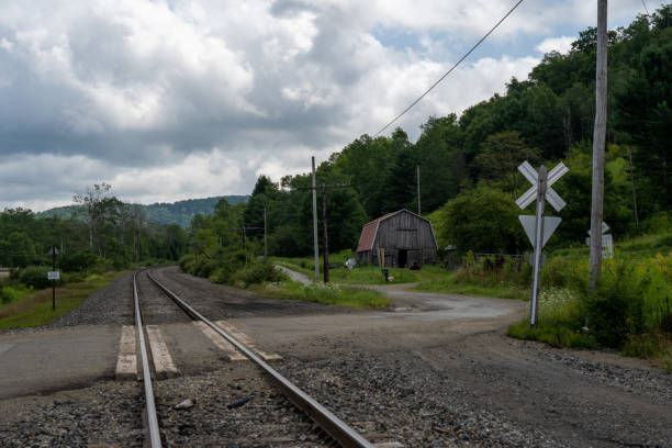 istock Railroad Crossing and Old Barn 1301185894