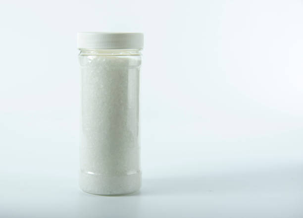 istock Transparent jar with salt on a light background. 1301187943