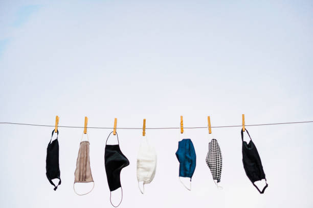 istock Many protective masks hanging on the rope 1301188593