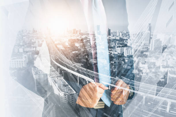 istock Double exposure effect-young businessman standing and thinking outside,with sunlight and cityscape,background,concept business,finance and investment 1301188736