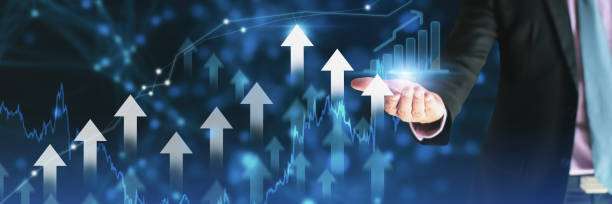 istock Businessman using holding symbol arrow up,stock graph and chart background,concept growth business and investment,Stock market and strategy for making market plan and stock market fluctuations 1301188783