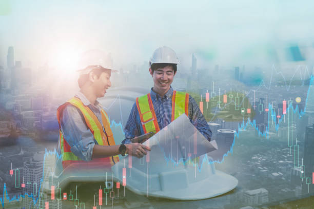 istock Double exposure-two asian engineer looking reading plan,blue print,smart city background,high rise construction development, helmet hat safety,real estate industry,investing stock market real estate 1301188931