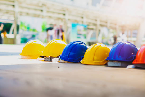 istock Helmet hat safety,smart city background,high rise construction development,concept real estate industry,investing stock market  real estate,safety at workplaces and construction sites 1301188939