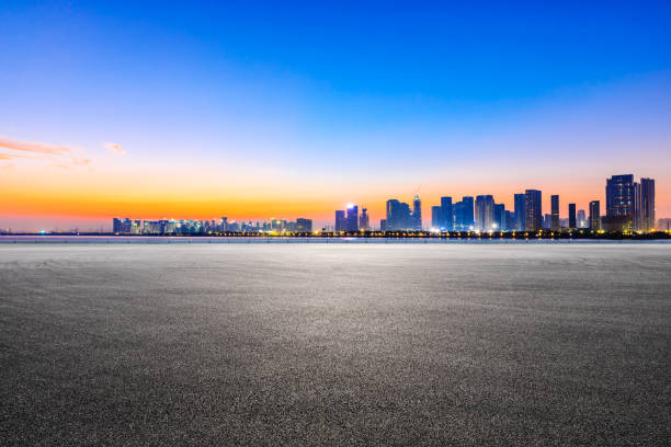 istock Empty road and Hangzhou skyline with buildings. 1301189644