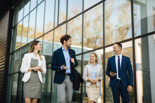 istock Four young executives talking on the street 1301191081