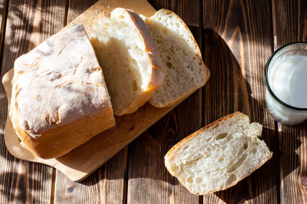 istock Rustic with yellow bread butter milk table on black background 1301193084