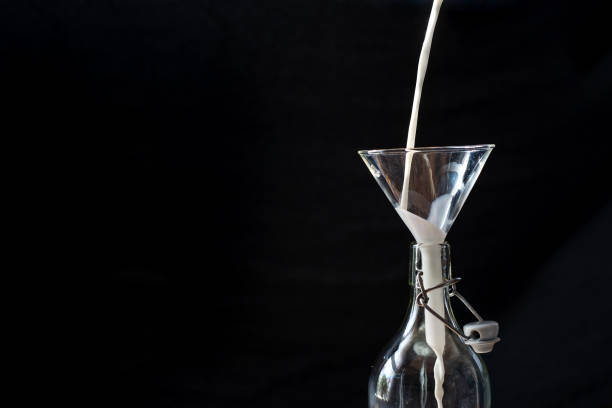 Retro closeup of neck bottle on black background.
