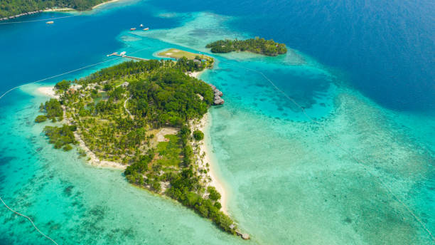 istock Tropical island with beach. Malipano island, Philippines, Samal 1301194725