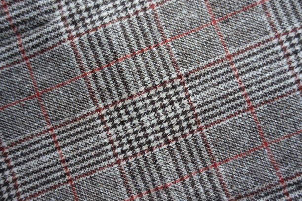 istock Gray and red Glen check fabric from above 1301196057