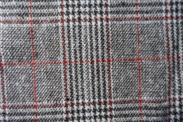 istock View of gray and red Glen check fabric from above 1301196072