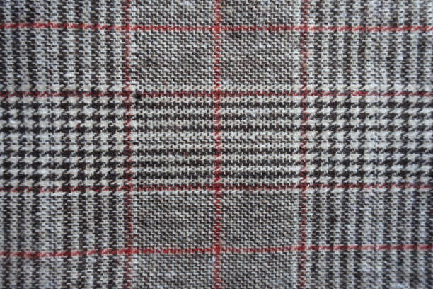 istock Top view of gray and red Glen check fabric 1301196107