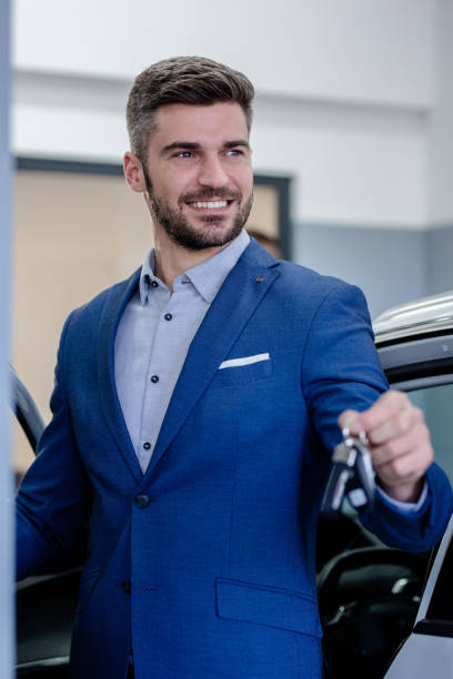 istock Businessman buying a car 1301196524
