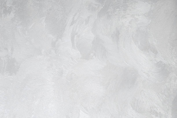 istock Decorative plaster. Grey wall texture background. Concrete style. Restoration indoors. Maintenance works. 1301198266