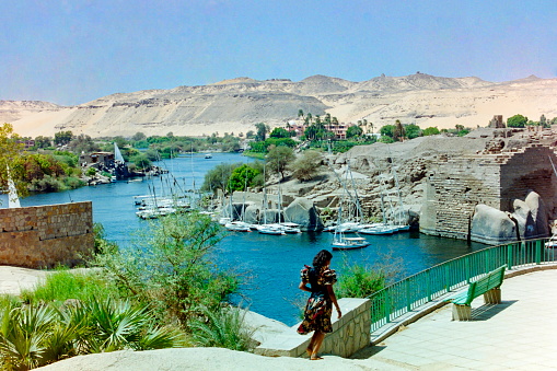 Aswan, Upper Egypt - August 1999: View to the island of Amoun  facing the Elephantine Island and the Old Cataract hotel. The image were scanned from old negative.