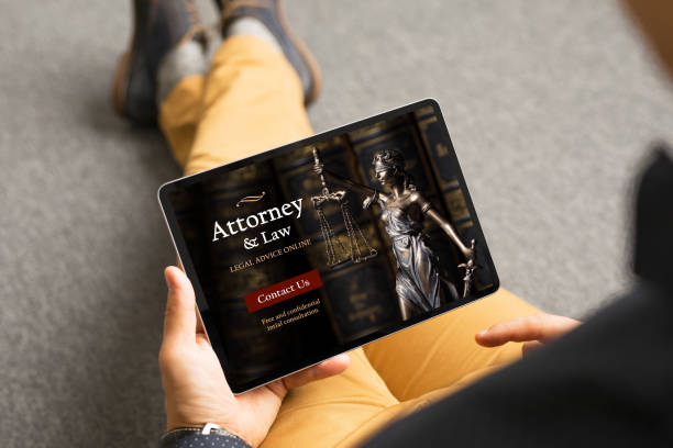 istock Man looking for legal help and viewing attorney's website 1301200241