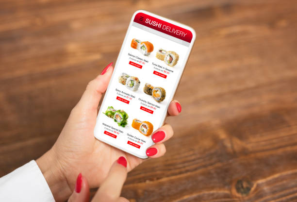 istock Woman ordering sushi online for home delivery 1301200271