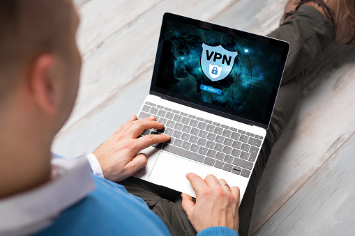 Male using VPN (Virtual Private Network) for secure and encrypted connection, also using internet anonymously.