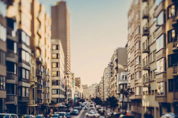 A street scene in the city of DeHaan at sunset