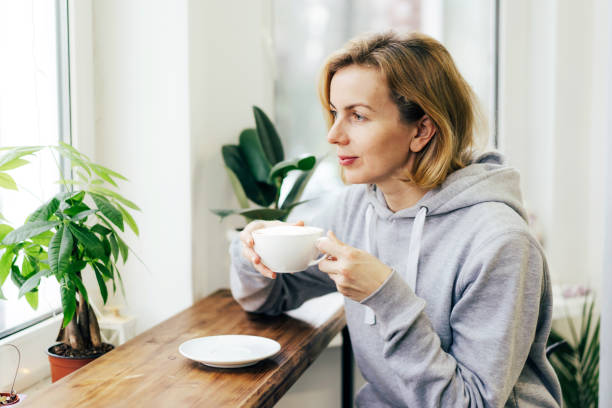 istock A woman is drinking coffee with pleasure 1301205072