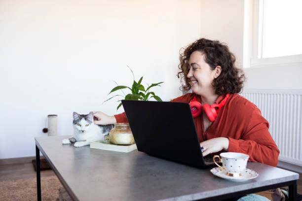 istock Young Woman living and working with pets 1301209646