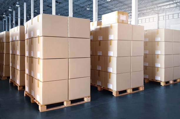 istock Interior of storage warehouse with stack of card board boxes on pallet rack. shipping warehouse. cargo export- import. 1301210086