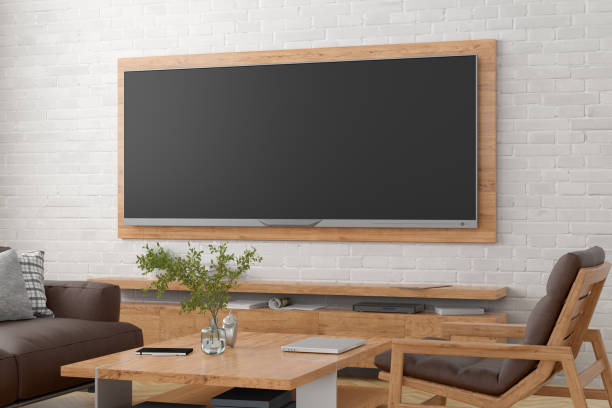 istock TV wide screen on the white brick wall. 1301217512